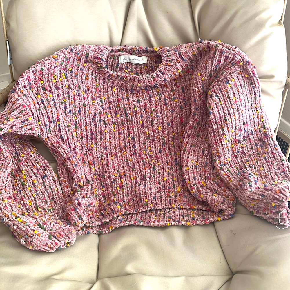 Pink cropped sweater with colorful Pom Pom detailing